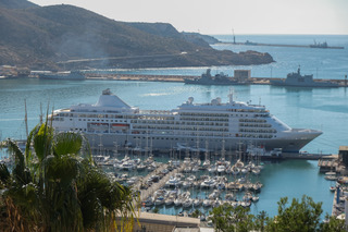 Luxury ocean cruise ship docked at a Mediterranean port